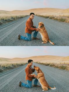 a man kneeling down next to a brown dog on top of a dirt road in the middle of nowhere