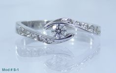 a white gold ring with diamonds on it