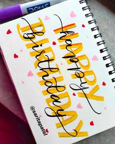 a notebook with the words happy birthday written on it