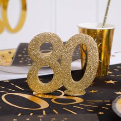 the table is decorated with gold numbers and confetti