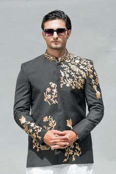 Welcome to Shiraz Saeed Our Retail Store: Rubina's Collection 2070 W Spring creek Pkwy Suite 328 Plano,TX USA 75023 Presenting Men's Black Embroidered Suiting Prince Coat (Kindly provide your size upon checkout) Color: Black Premium Suiting Fabric with Hand Embroidery on Front, Sleeves and Neck. Italian Thread Simple & Decent Metal Buttons Finest Stitch Branded Design Custom Sizes are also available. Fit Type: Regular fit Wash Care Instructions: Dry Clean Only Suitable For India Wedding, Festivals And Social Gatherings Disclaimer Due to the photographic lighting & different screen calibrations, the colors of the original product may slightly vary from the picture. Ceremonial Embroidered Traditional Fit Bandhgala, Semi-formal Long Sleeve Sets With Resham Embroidery, Embroidered Suits For Eid Designer Wear, Tailored Festive Long Sleeve Sets, Festive Embroidered Fitted Bandhgala, Formal Traditional Outerwear With Floral Embroidery, Traditional Formal Outerwear With Floral Embroidery, Designer Long Sleeve Suits For Festive Occasions, Traditional Floral Embroidered Outerwear For Formal Occasions