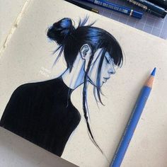 a drawing of a woman's head with her hair pulled back and blue pencils next to it