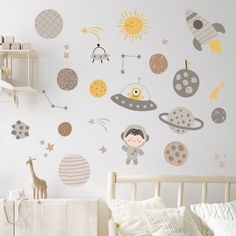 a child's bedroom with wall decals and bedding