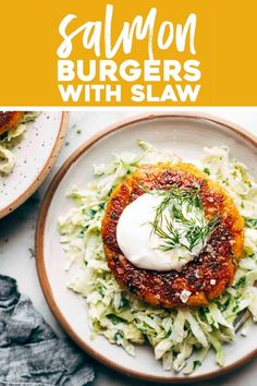 salmon burgers with slaw on a white plate and yellow border over the top