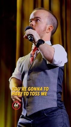 a man in a vest and tie singing into a microphone with the caption you're going to have to toss me