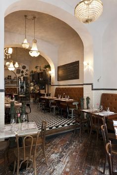 an instagram photo of a restaurant with tables and chairs