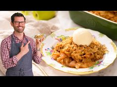 a man standing in front of a plate with food on it and an ice cream scooper