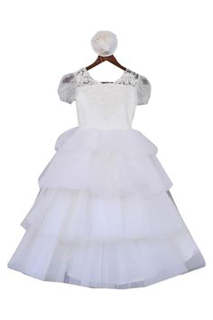 Adorably cute, this layered frill gown turns your daughter's fairytale dreams into reality. Accentuated with button front detailing and floral embroidery around the neckline, this alluring gown is a dream-come-true for your beautiful princess.
No of components: 1
layered style
frill detail
v- neckline
floral embroidery - Aza Fashions White Ruffled Ball Gown For First Communion, First Communion Princess Dress With Ruffles, Princess Dress With Ruffles And Fitted Bodice, Princess Dress With Ruffles And Fitted Bodice Ball Gown, Fitted Bodice Princess Dress With Ruffles, Princess Ball Gown Dress With Ruffles And Fitted Bodice, First Communion Tulle Dress With Ruffles, Tulle First Communion Dress With Ruffles For Wedding, White Tulle First Communion Dress With Ruffles