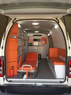 an orange and white van with the back door open to show it's interior