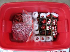 a red tray filled with assorted candy and candies