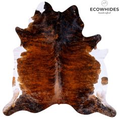 a brown and white cowhide rug on a white background