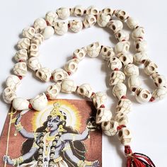 "Embrace the essence of Goddess Kali with our 54+1 Kali Skull Mala necklace.  Handcrafted with devotion, this mala features 54 beads plus a \"guru\" bead, allowing you to deepen your meditation practice and channel Kali's powerful energy. Our Kali Skull Mala is a tribute to Goddess Kali's fierce strength and transformative energy. Wear it as a reminder of your inner power and resilience. Each bead invites you into a state of focused meditation and reflection. The additional \"guru\" bead marks the beginning and end of your mantra recitations. The skull beads pay homage to Kali's unique symbolism, while the tassel adds a touch of elegance. This mala seamlessly blends spirituality with style. Meticulously crafted by skilled artisans, our Kali Skull Mala ensures that each bead is infused with Luxury Festive Mala For Festivals, Skull Rosary Necklace, Focused Meditation, Ma Kali, Mata Ji, Goddess Kali, Skull Beads, Mala Meditation, Expensive Jewelry Luxury