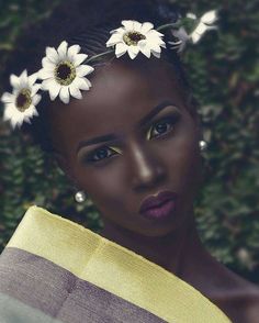 a woman with white flowers in her hair