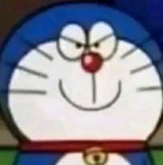 the face of a cartoon character wearing a blue and white outfit with red nose ring