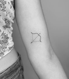 a woman with a small tattoo on her arm