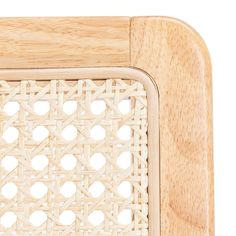 a close up of a wooden chair with holes in it's seat cushion and back