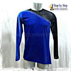 a male mannequin wearing a blue shirt with black sleeves and an embellishment on the chest