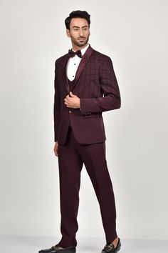 Steel wine tuxedo with bead embroidery details. Paired with a waistcoat, shirt, pant and bow.
Components: 5
Pattern: Embroidered
Type Of Work: Bead
Neckline: Lapel collar
Sleeve Type: Long
Fabric: Crepe, Handloom Silk, Terry Rayon
Color: Wine
Other Details: 
Note: Brooch and pocket square shown in the image is not for sale.
Occasion: Reception, Cocktail - Aza Fashions Elegant Fitted Outerwear For Gala, Elegant Embellished Sets For Gala, Elegant Festive Set For Gala, Tailored Three-piece Suit For Party, Fitted Tuxedo Style Blazer For Gala, Fitted Tuxedo Blazer For Gala, Elegant Burgundy Suits For Formal Occasions, Tailored Embellished Suits For Gala, Fitted Embellished Outerwear With Notch Lapel