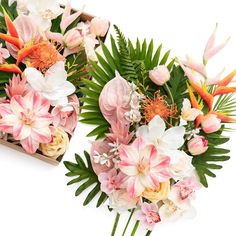 two wooden boxes filled with pink and white flowers