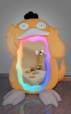 an odd looking light up mirror in the shape of a cartoon character