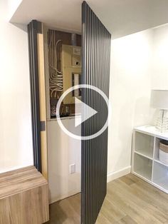 a room with white walls and wood flooring is shown in this video showing an open door