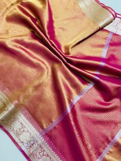 Banarasi semi tissue soft silk saree available in beautiful vibrant colours, this saree comes with a self colour running blouse with the border same as saree. Measurement: Saree length- 5.5 metres Blouse length- 1 metres Saree weight- 550 grams (approx). Disclaimer- The colour of actual product may vary slightly due to photographic lighting conditions and difference in device screen resolution. Rest assure that you'll get the same product that you'll order from my shop within the time mention fo Saree For Onam, Saree For Diwali, Diwali Saree, Tissue Silk Saree, Wedding Saree, Soft Silk Sarees, Gift For Wife, Blouse Length, Photographic Lighting