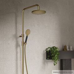 a gold shower head with thermostaer and hand held shower faucet