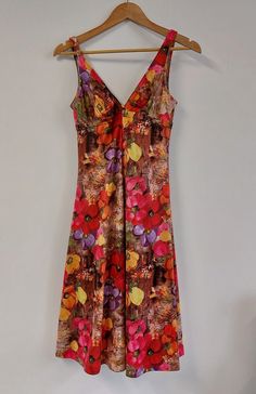 "Fabulous floral print mid-length sleeveless summer dress, circa late 1960s/early 1970s. Fitted style to bust with strappy V-neckline, and full skirt.  The perfect dress for a summer celebration or evening out!  Material: Polyester Condition: Excellent vintage condition - no damage or obvious signs of wear Recommended care: Machine wash Sizing: Label states UK Size 14 - would recommend current UK Size 10/12. Please see exact measurements below. Measurements (item laid flat): - Length (straps to hem) 106cms/41.75\" - Bust (width, doubled) 70cms/27.5\" - Waist (width, doubled) 80cms/31.5\" All items are clean and ready to wear. Want any further details, images or measurements? Feel free to get in touch if you'd like any further information about this item. RETURNS If an item doesn't quite fi Sleeveless Summer Dress, Late 1960s, Summer Celebration, Uk Size 10, Fitted Style, Sleeveless Dress Summer, 70s Dress, Floral Dress Summer, Dress Clothes For Women