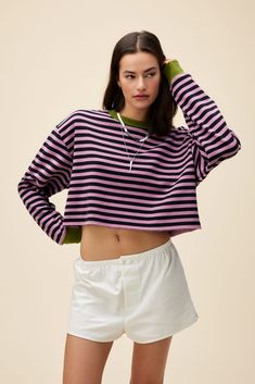 Sporty Striped Top With Ribbed Cuffs, Spring Striped Sweater With Ribbed Collar, Casual Pink Tops With Contrast Stripes, Sporty Striped Tops With Ribbed Collar, Retro Spring Sweater With Ribbed Cuffs, Casual Tops With Striped Cuffs And Relaxed Fit, Casual Striped Sweatshirt With Ribbed Collar, Casual Relaxed Fit Top With Striped Cuffs, Spring Striped Sweatshirt With Contrast Stripes