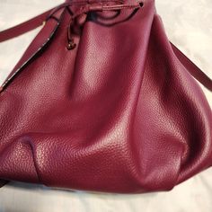 Never Used Halston Burgundy Leather Backpack Purse With Straps And Handle. Interior Drawstrings Clasp Closure And Side Zipper Pocket. Designer Gold Decorative Hardware. Msrp Of $120. Red Leather Backpack With Adjustable Strap For On-the-go, Burgundy Travel Bag With Adjustable Strap, Crossbody Backpack With Adjustable Strap In Faux Leather, Crossbody Faux Leather Backpack With Adjustable Strap, Faux Leather Crossbody Backpack With Adjustable Strap, Burgundy Satchel With Adjustable Strap For On-the-go, Red Crossbody Backpack With Adjustable Strap, Leather Backpack With Adjustable Strap In Burgundy, Burgundy Bag With Adjustable Strap For On-the-go