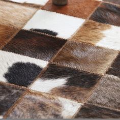 a close up of a checkered table cloth with an animal print pattern on it