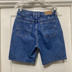 Vintage 90s/Y2k Lee Riders Denim Shorts Made in Mexico.  No rips or stains save for slight discoloration on the back waist.  Tag says size 30 1/2 X 31 1/2.  The waist measures 15.5'' flat across and the length from waist to bottom along the side is 19'' with an inseam of 9'' and rise of 12.5''. Y2k Medium Wash Short Length Jeans, 90s Style Medium Wash Straight Leg Jean Shorts, 90s Style Straight Leg Medium Wash Jean Shorts, 90s Style Dark Wash Short Length Jeans, 90s Style Dark Wash Short Jeans, 90s Style Short Length Cotton Jeans, 90s Denim Jean Shorts Straight Leg, 90s Style Dark Wash Cotton Jean Shorts, 90s Denim Straight Leg Jean Shorts