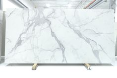 a large white marble slab in a warehouse