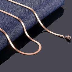 THIS ITEM SHIPS SAME OR NEXT-DAY 📦✈ The herringbone or snake chain is a sleek must-have that sits at your collarbone and shines in the sun unapologetically. Use this essential as the base of your layers or wear on its own for an effortless look. 5mm herringbone design Perfect for layering Plated rose gold Stainless steel Tarnish-free, hypoallergenic and waterproof Available in 18" or 20" Also available in silver or gold HERE. Rose Gold Metal Snake Chain Necklace, Minimalist Rose Gold Snake Chain Necklace, Flat Chain Necklace, Herringbone Design, Stainless Steel Accessories, Unique Gifts For Men, Versatile Jewelry, Snake Necklace, Stainless Steel Necklace