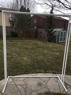 an empty swing frame in the yard