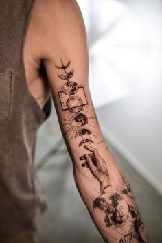 a man with a tattoo on his arm that has pictures and symbols all over it