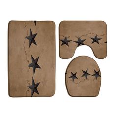 three piece bathroom set with black stars on tan background and matching toilet seat covers in the shape of four - pointed stars