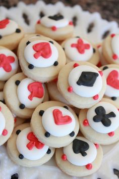 there are many decorated cookies in the shape of hearts and spades on top of each other