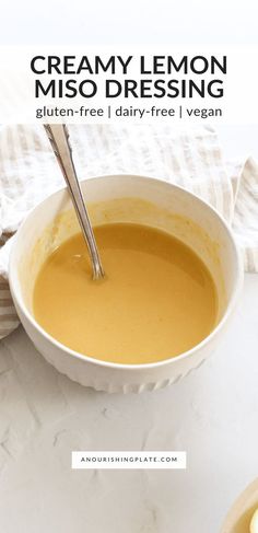 a bowl of creamy lemon miso dressing with a spoon in it