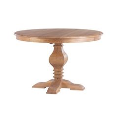 a round wooden table with two leaves on the top and one leaf at the base