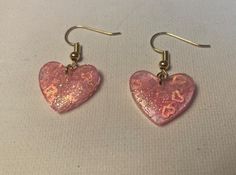 Cute heart shaped epoxy pendants with tiny smaller pink hearts and pink glitter encased inside. Set on gold hooks Epoxy Pendants, Gold Hooks, Cute Heart, Pink Hearts, Wedding Jewelry Earrings, Pink Glitter, Wedding Earrings, Heart Earrings, Pink Heart