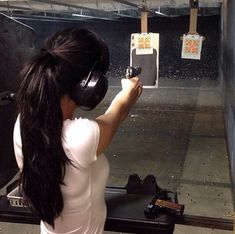 a woman with headphones on taking a photo