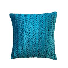 a blue pillow with wavy lines on the front and back, sitting against a white background