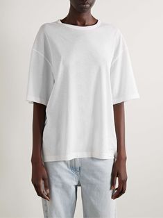 White Relaxed Fit Organic Cotton T-shirt, Oversized White Organic Cotton Top, White Boxy Fit Crew Neck Top, Modern Relaxed Fit Top With Drop Shoulder, White Tops With Relaxed Fit And Straight Hem, Modern Tops With Relaxed Fit And Drop Shoulder, Oversized Organic Cotton Crew Neck Top, Oversized Crew Neck Top In Organic Cotton, Modern Oversized White T-shirt