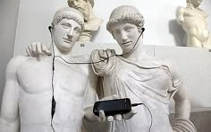 there are two statues with wires attached to them