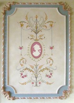 an ornate frame with a woman's profile on it