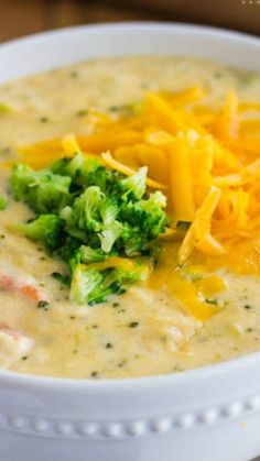 a white bowl filled with broccoli and cheese