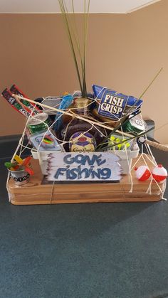 a fishing themed gift basket on a table