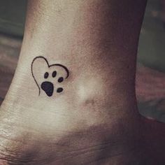 a dog paw with a heart tattoo on the ankle