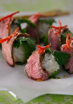 some food is laying on a plate and ready to be eaten with chopsticks